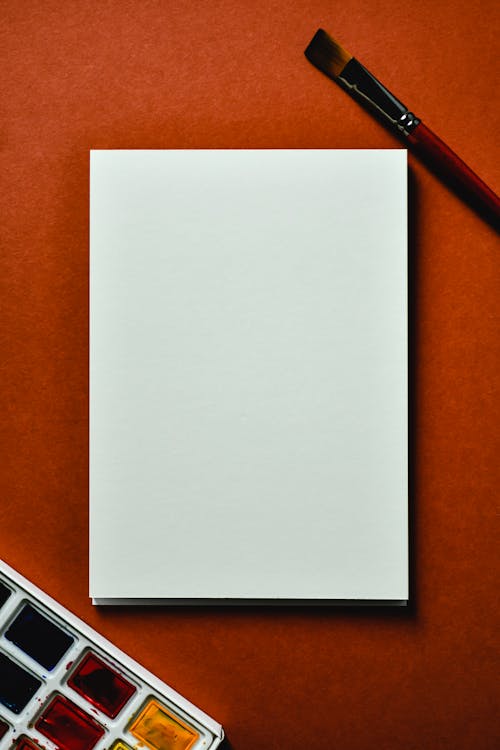 Blank White Paper Beside a Water Color Brush