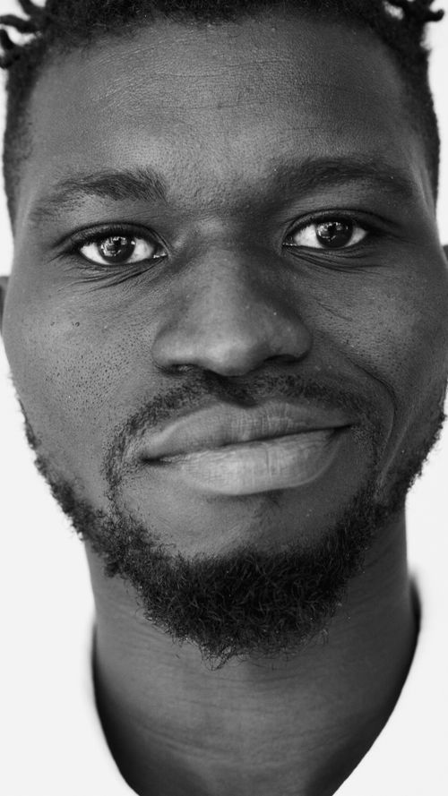 Free Close-up black and white portrait of a smiling man with a beard. Stock Photo