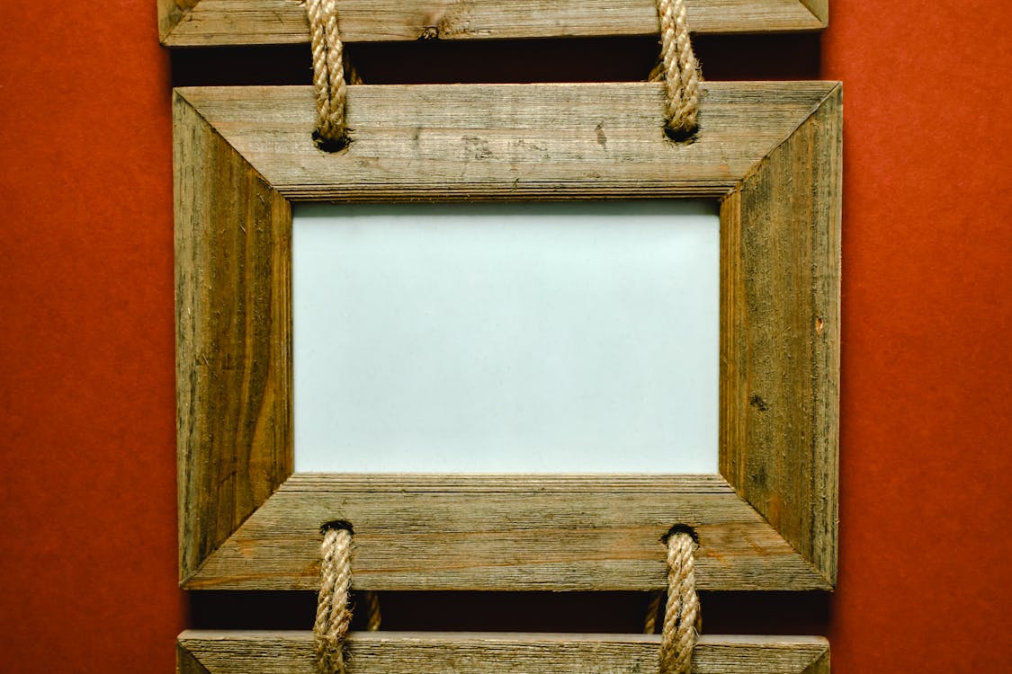 Brown Wooden Picture Frame Hanging with Ropes ยท Free Stock Photo