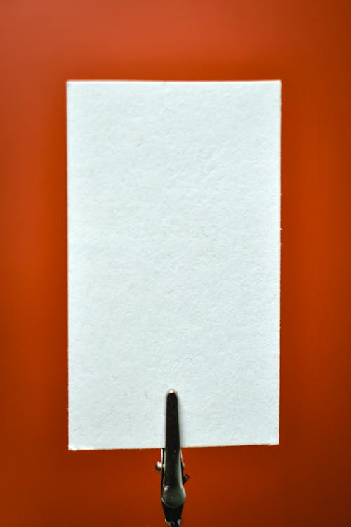 White Piece of Paper on a Red Background