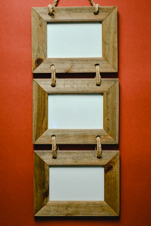 Free Wooden Frames Hanging on a Wall Stock Photo