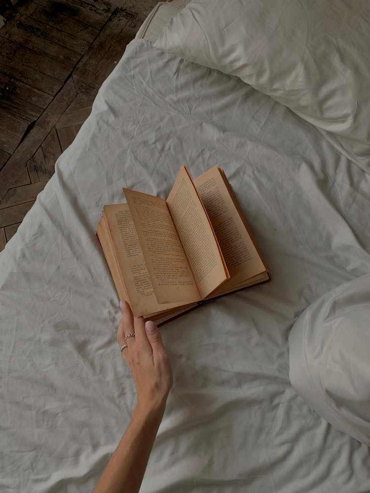 A Book On A Bed 