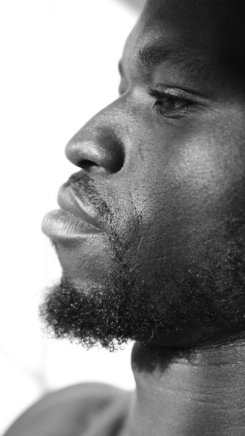 Free Monochrome side view of a bearded man displaying strong facial features. Stock Photo