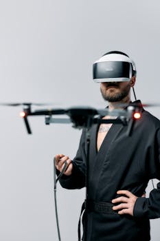 Man controlling a drone with virtual reality headset in a studio setting.