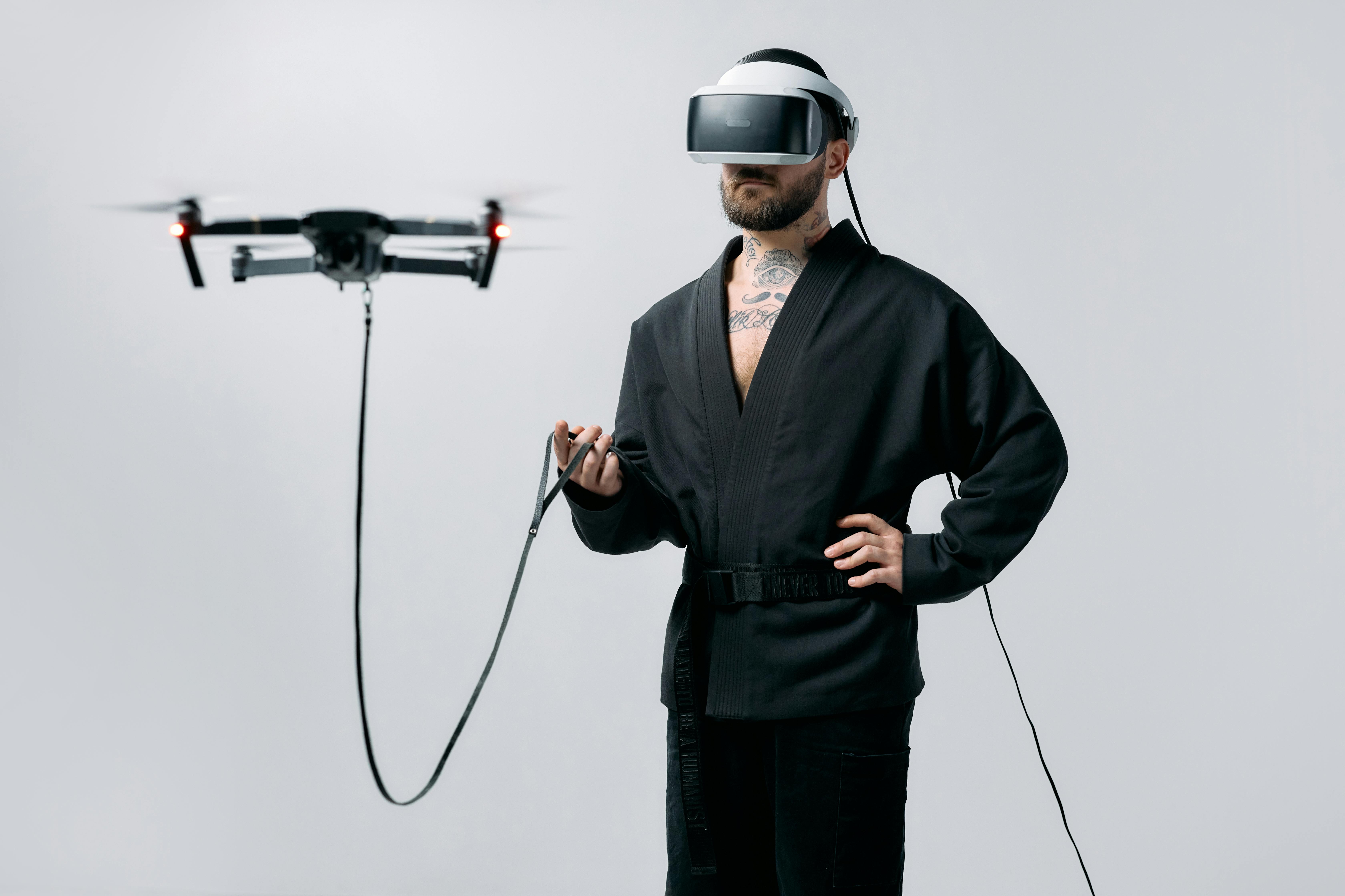 photo of man wearing virtual reality headphones