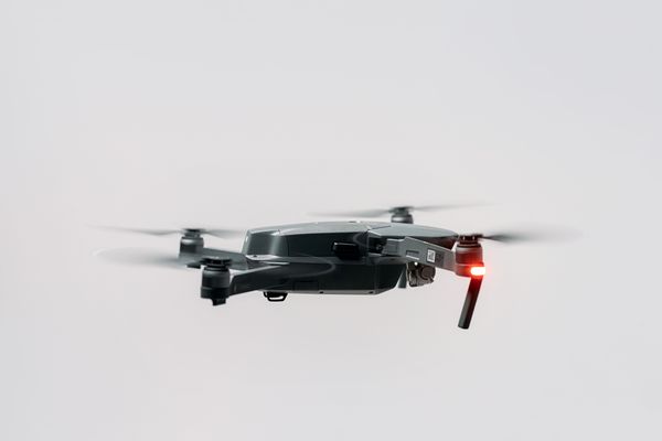 Camera drone hovering with motion-blurred rotors — photo by cottonbro studio on Pexels
