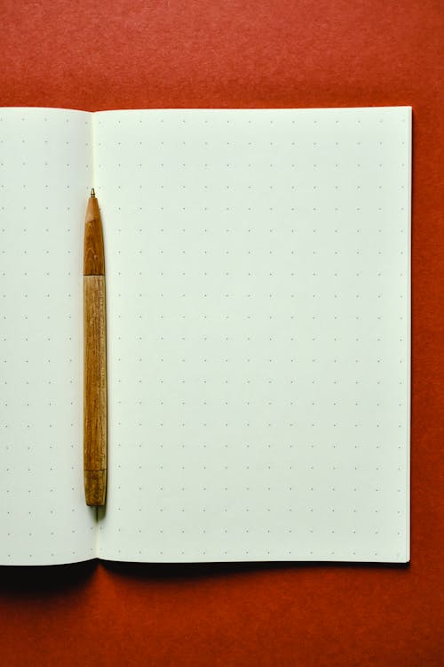 Brown Pen on White Paper