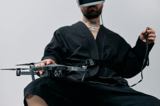 Man wearing virtual reality headset, interacting with drone indoors.