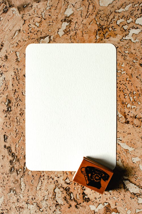 White Paper over a Brown Rough Surface