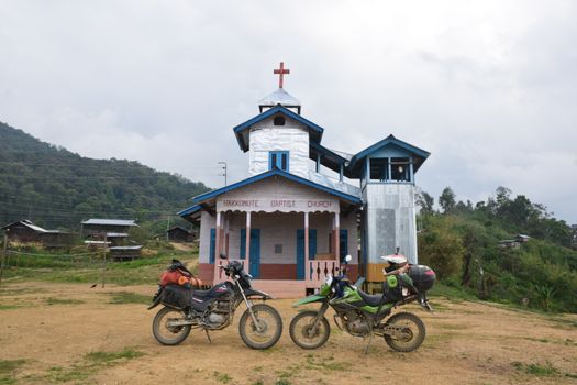 Dirt Bikes Parked Outside a Church