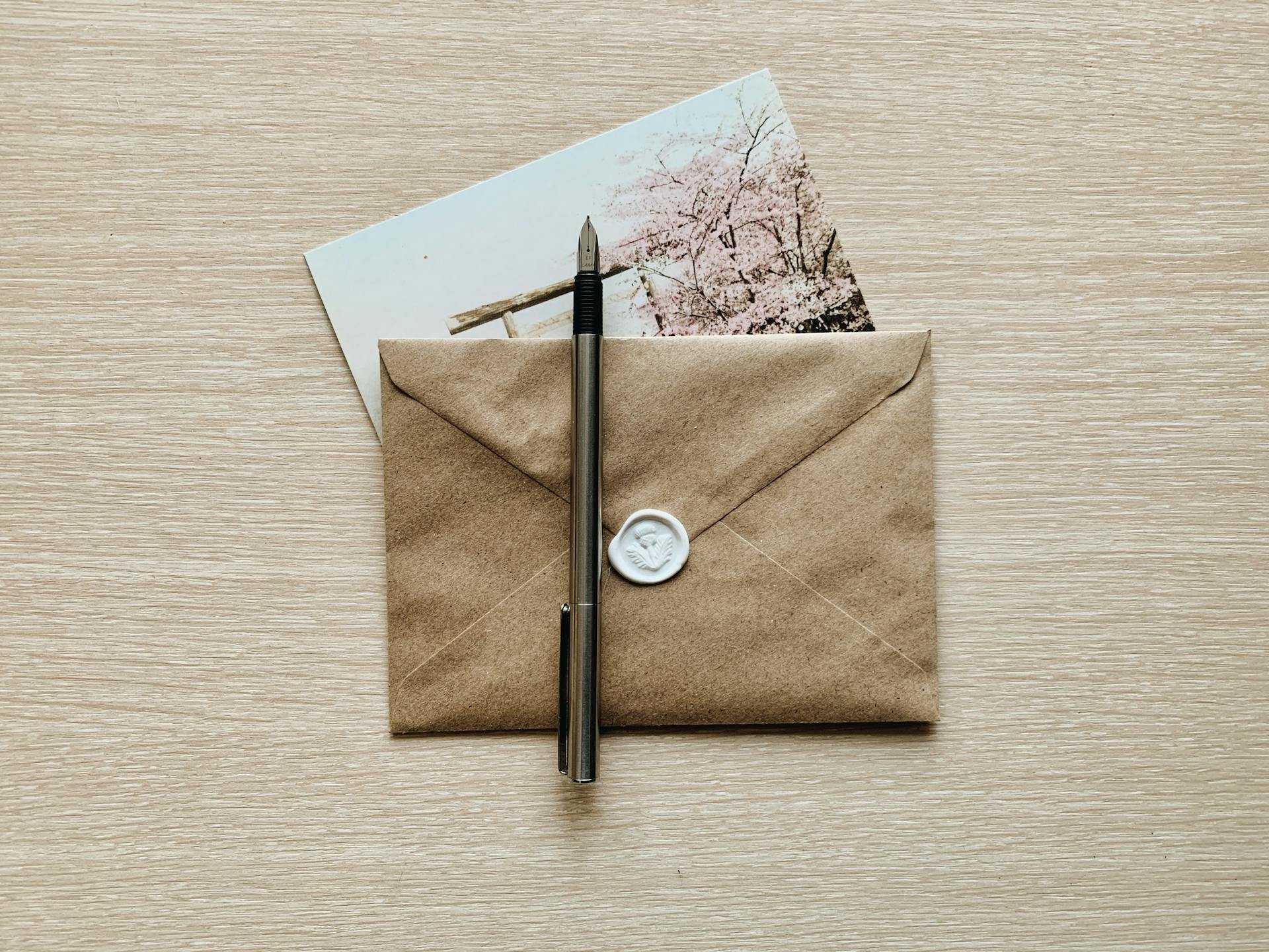Overhead Shot of a Fountain Pen on a Sealed Envelope