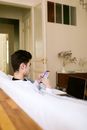 Man in White Dress Shirt Holding Silver Iphone 6