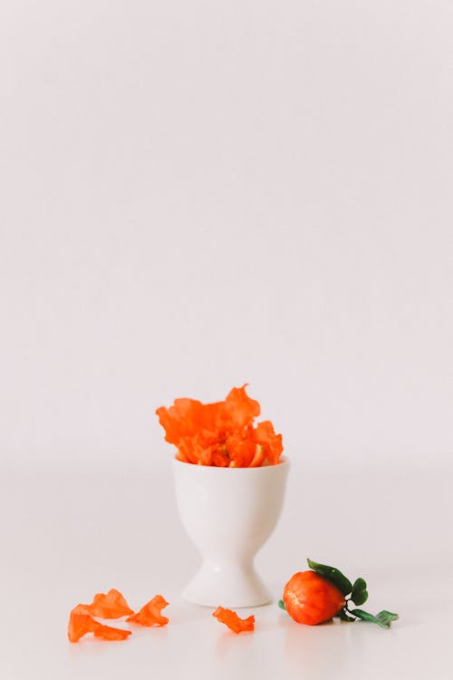 Orange Petals in a Ceramic Egg Holder 