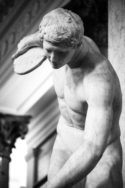 Elegant grayscale image of a classical marble sculpture, focusing on artistry and form.