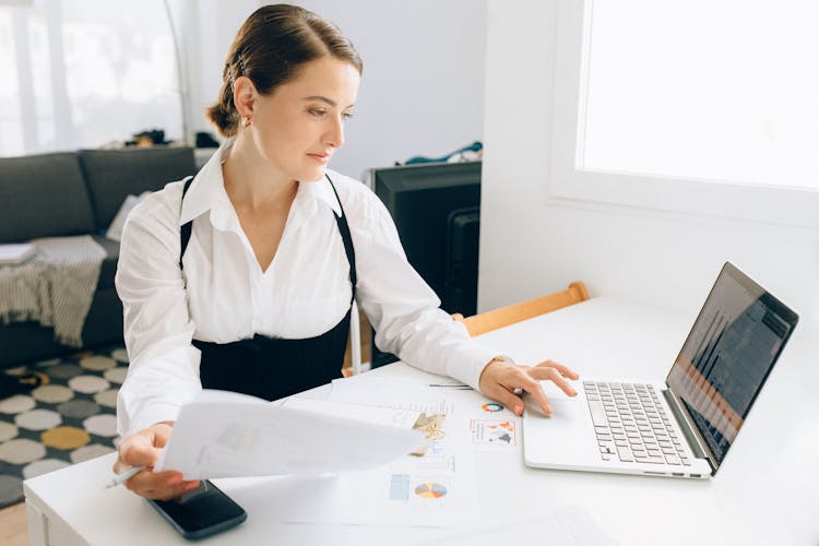 A Woman Using A Laptop