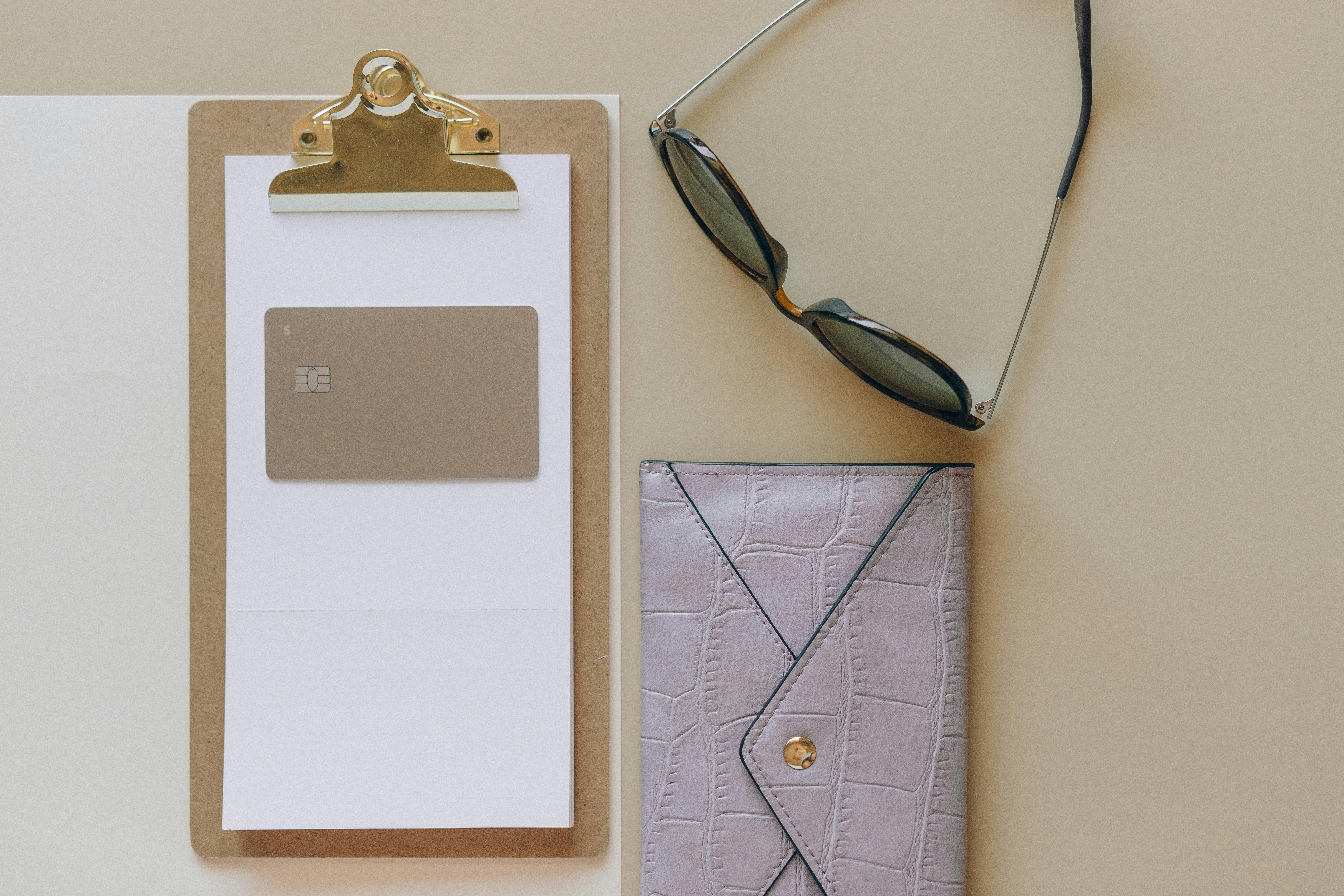 sunglasses beside a clipboard