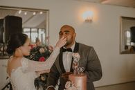 Bride feeding her Groom