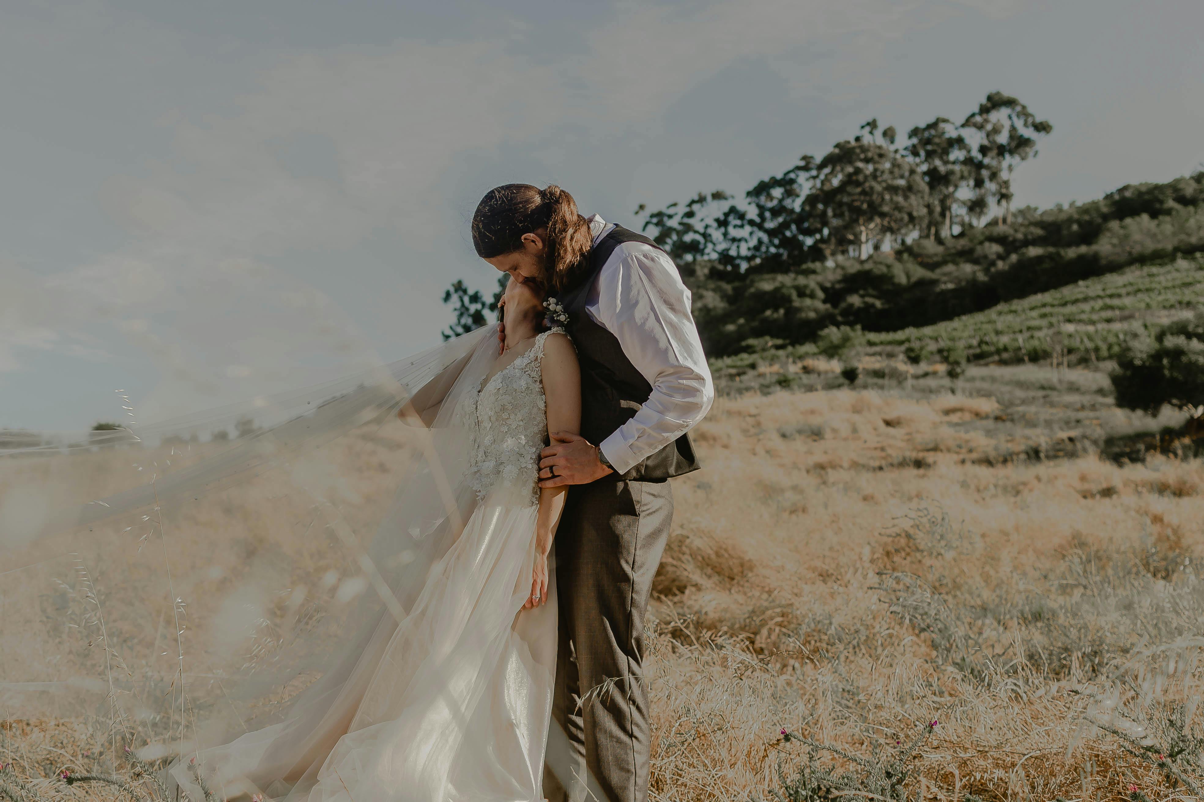 Couple Hugging by Building · Free Stock Photo