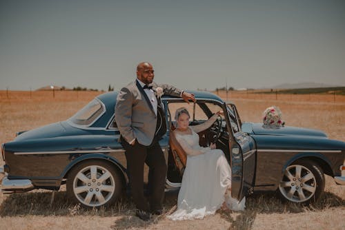 Bride and Groom in a Vintage Car
