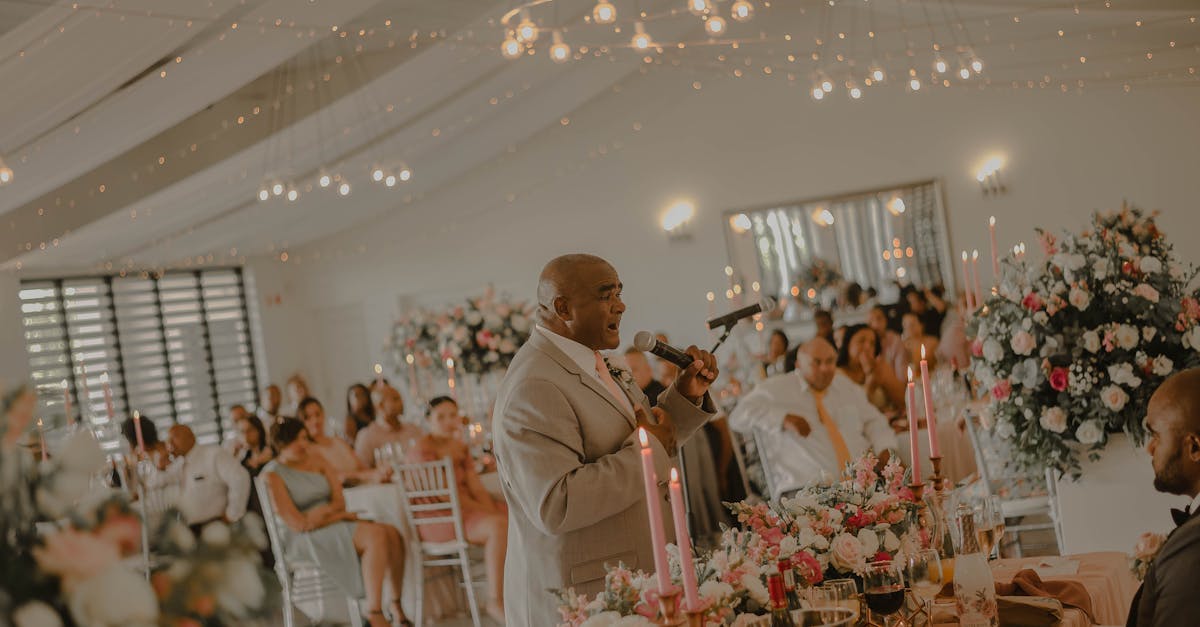 Wedding Reception With Guests Listening To Speeches