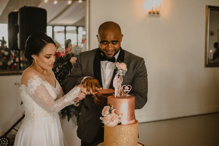 Newlyweds Cutting Wedding Cake