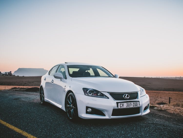 White Expensive Lexus Car Parked On An Asphalt Road