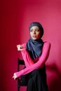 Woman in Black Hijab and Purple Abaya