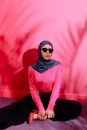 Woman in Pink Hijab and Black Long Sleeve Shirt