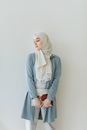 Woman in Gray Hijab and White Long Sleeve Dress