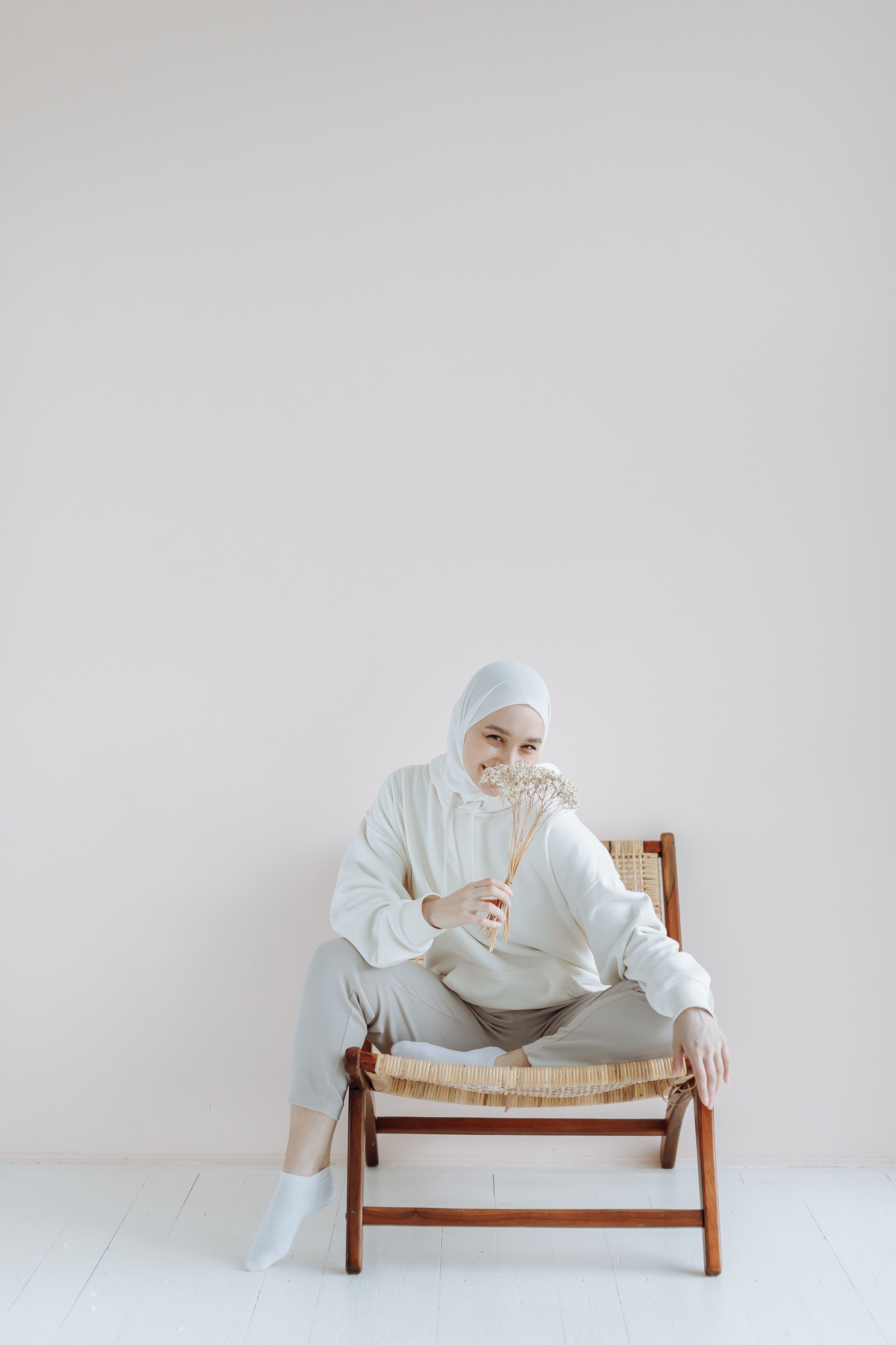 A Woman in White Long Sleeve Shirt Sitting at the Chair · Free Stock Photo
