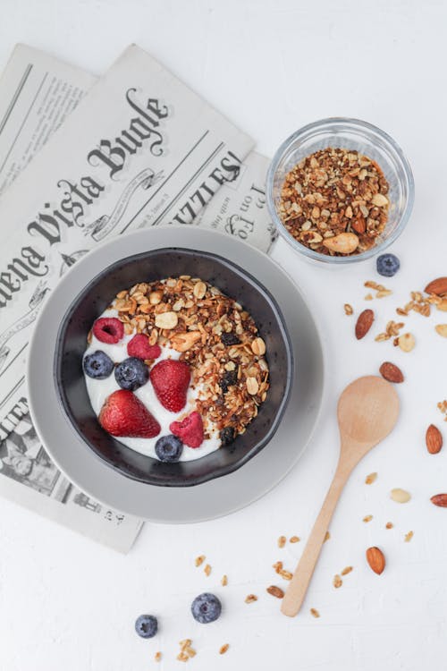 A Breakfast Yogurt Bowl on a Newspaper