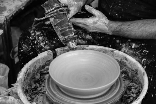 Person Holding Round White and Blue Ceramic Plate