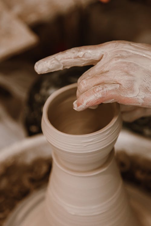 Free A Person Making a Clay Pot Stock Photo
