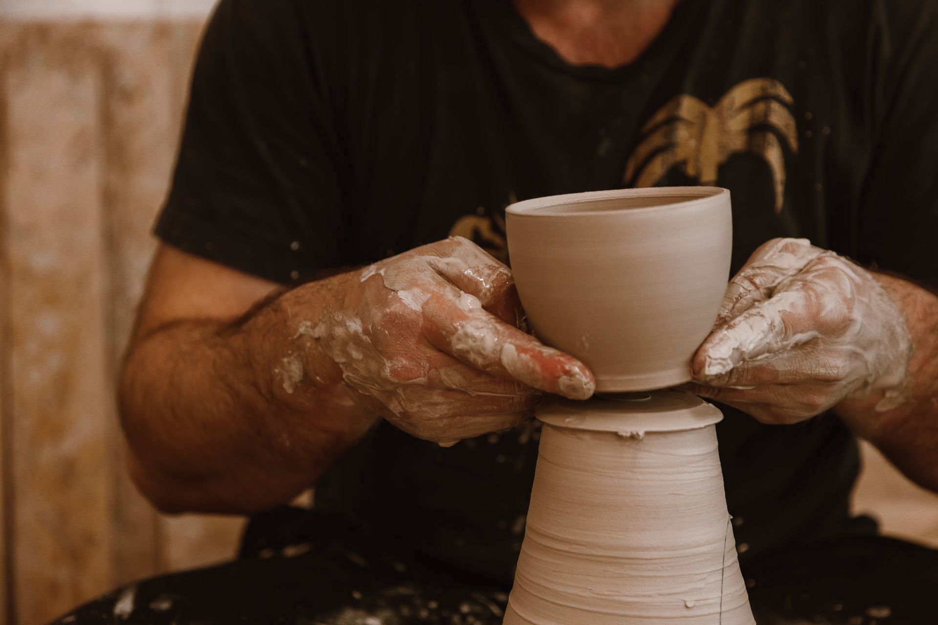 A Person Making a Clay Pot