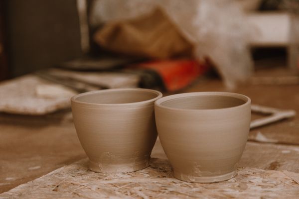 Two handmade clay pots in an artisan pottery workshop — ROMAN ODINTSOV on Pexels