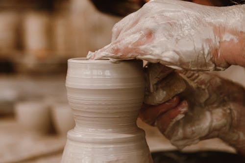 Person Making a Clay Pot 