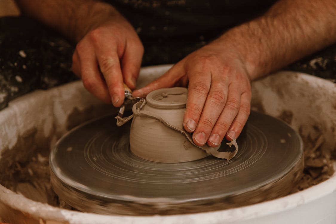Free Hands Making Clay Bowl Stock Photo