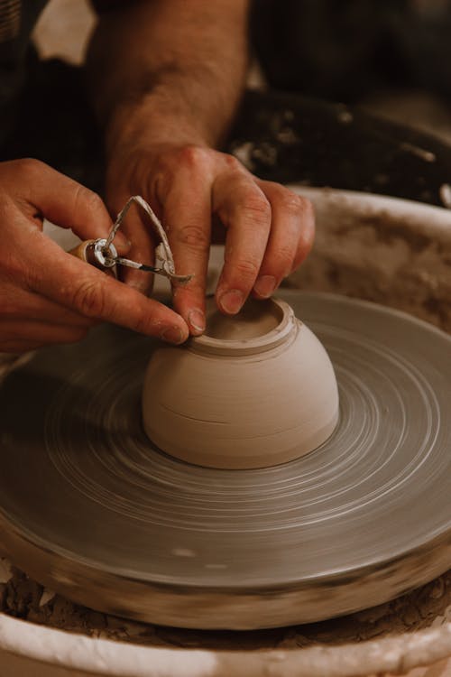 Person Making a Clay Bowl