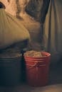 Brown Plastic Round Container With Brown Powder