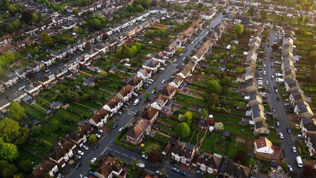 Drone shot of residential community in Luton, England, showcasing houses and roads.