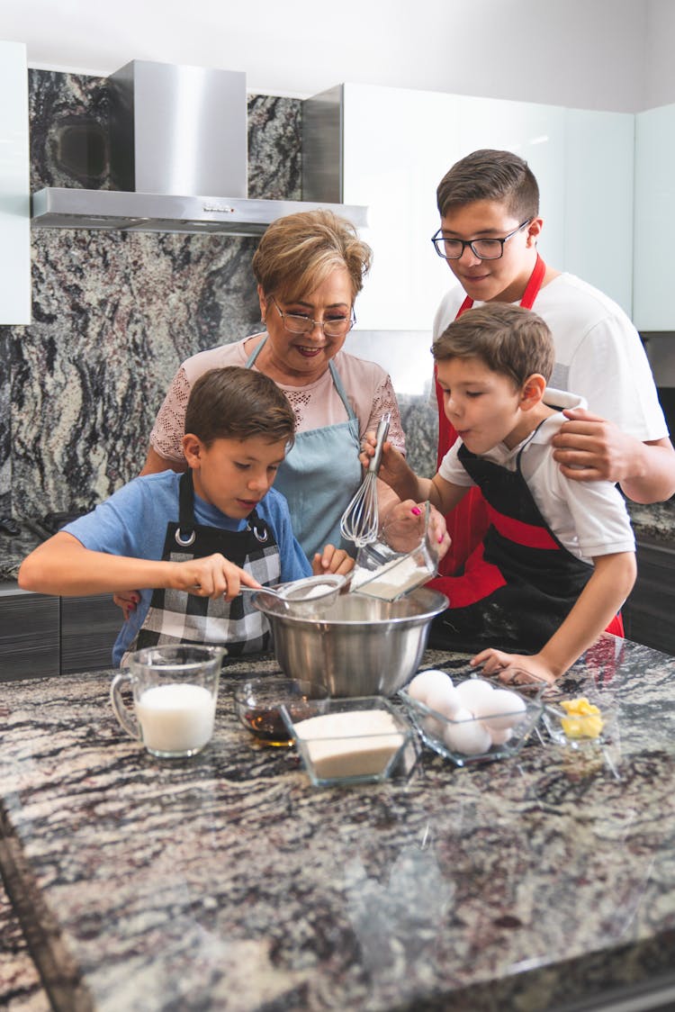 Boys Helping Their Grandma Doing Baking