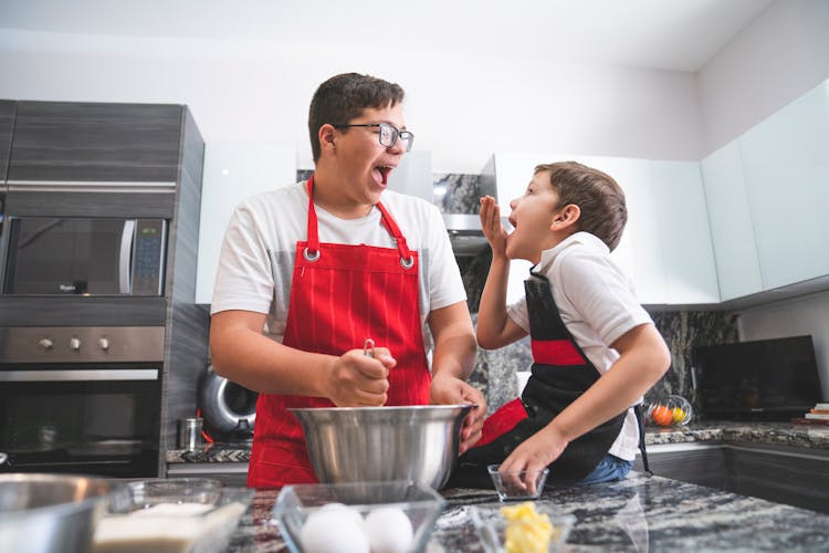 Father And Son Baking In The Kitchen