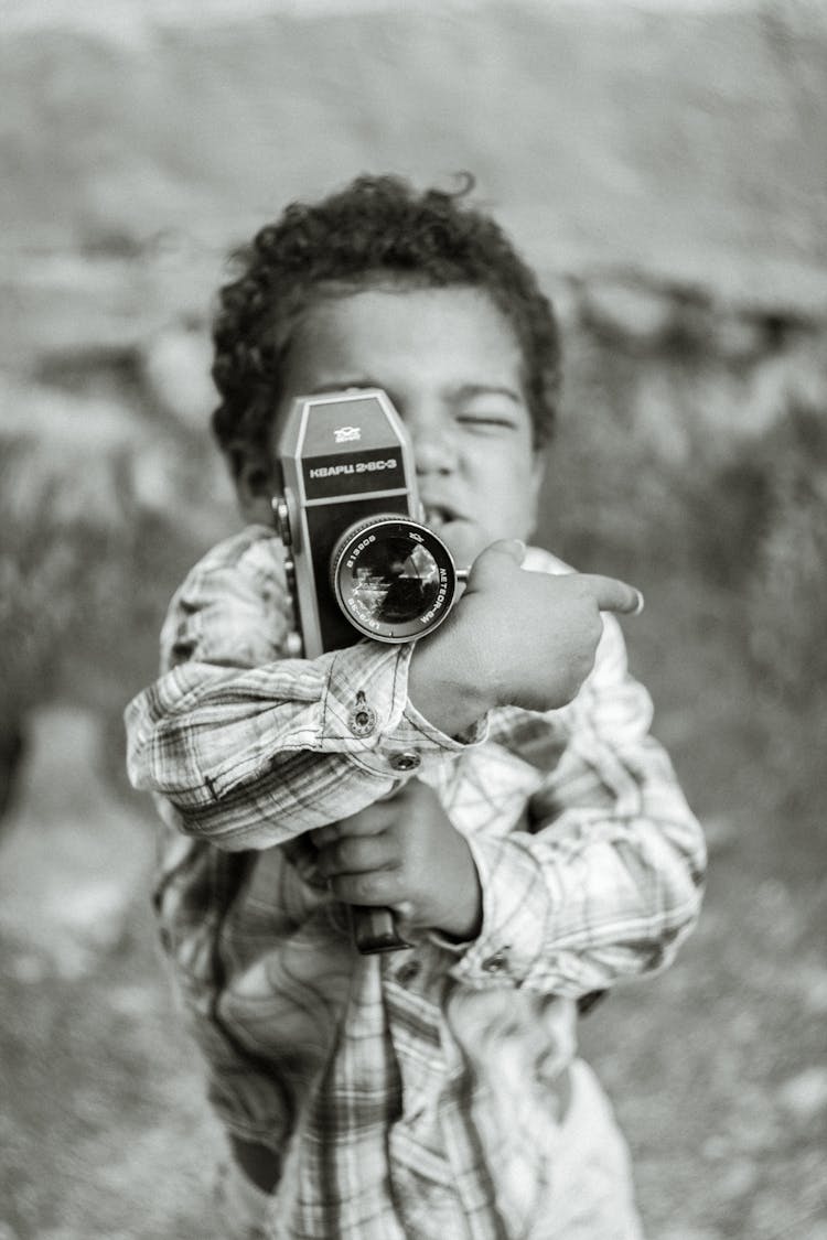 Boy Holding Camera