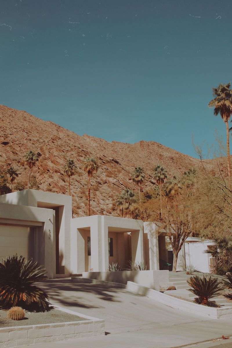 Modern white villa set against an arid hillside