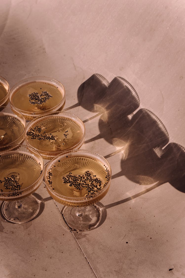 A Champagne Glasses On A Flat Surface