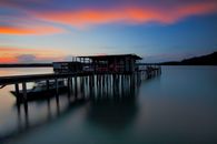 Brown Wooden Dock on Body of Water during Sunset