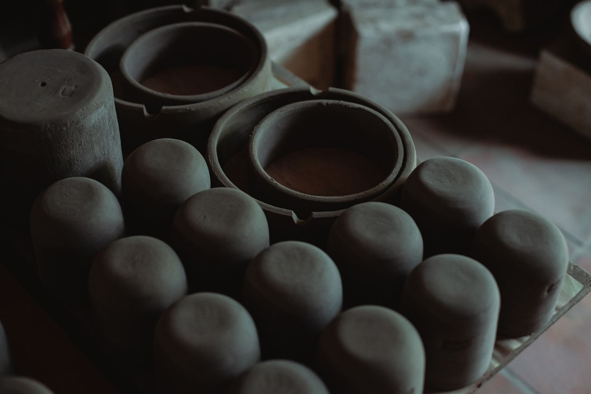 Detailed view of clay pottery showing craftsmanship in a workshop setting.