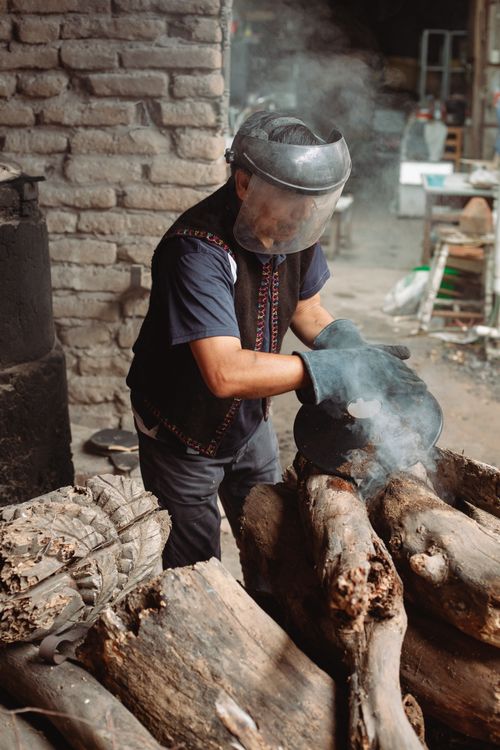 Free A potter working with clay in a traditional rustic workshop, showcasing handmade craftsmanship. Stock Photo