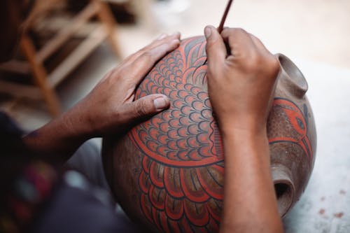 A Man Painting on the Jar