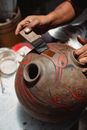 Person Holding Brown Wooden Vase